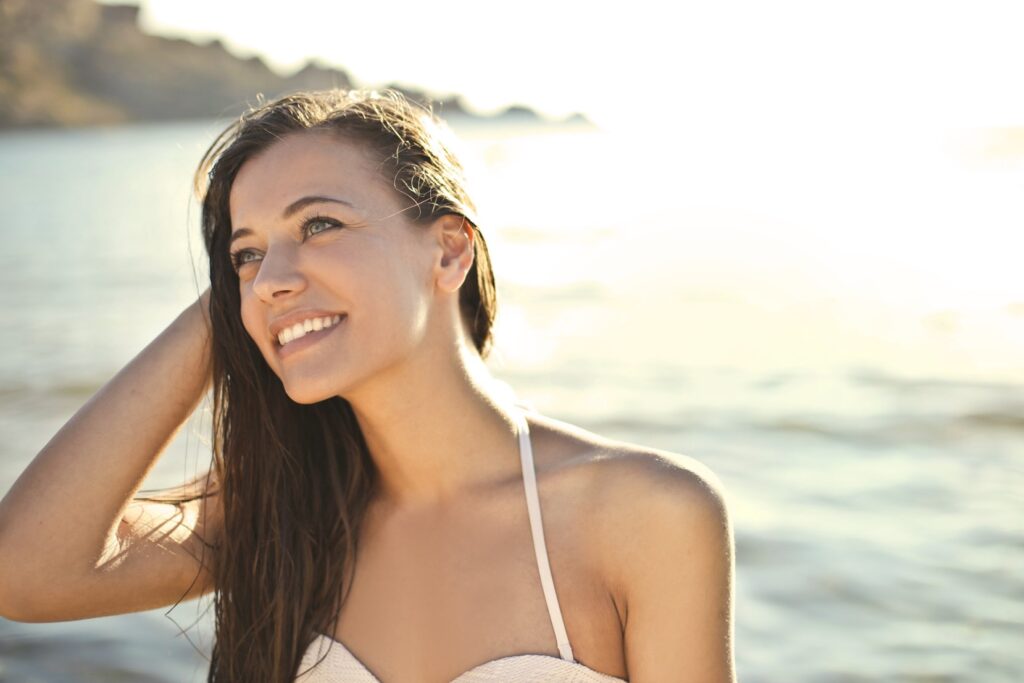 Smiling woman enjoying the beach
